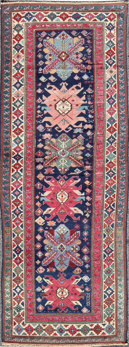 Antique Late 19th Century Kazak Caucasian Runner in Navy Blue Background. Keivan Woven Arts / rug 16 - 0603, country of origin / type: Caucus / Caucasian, circa 1890. Antique Geometric Caucasian Kazak. Measures: 3'6 x 9'9. This antique Caucasian r... - Keivan Woven Arts16 - 0603 - 7419Rug