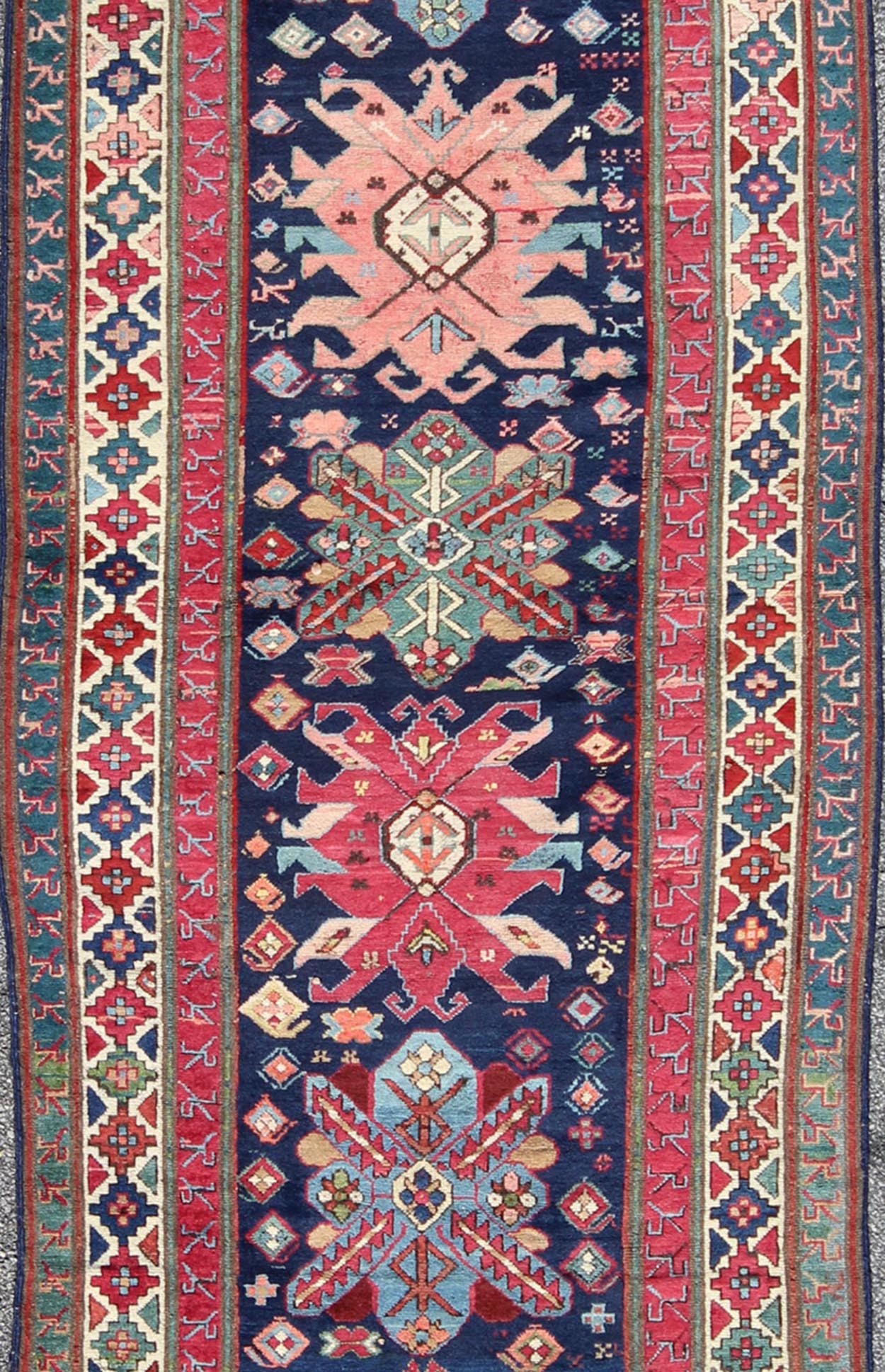 Antique Late 19th Century Kazak Caucasian Runner in Navy Blue Background. Keivan Woven Arts / rug 16 - 0603, country of origin / type: Caucus / Caucasian, circa 1890. Antique Geometric Caucasian Kazak. Measures: 3'6 x 9'9. This antique Caucasian r... - Keivan Woven Arts16 - 0603 - 7419Rug