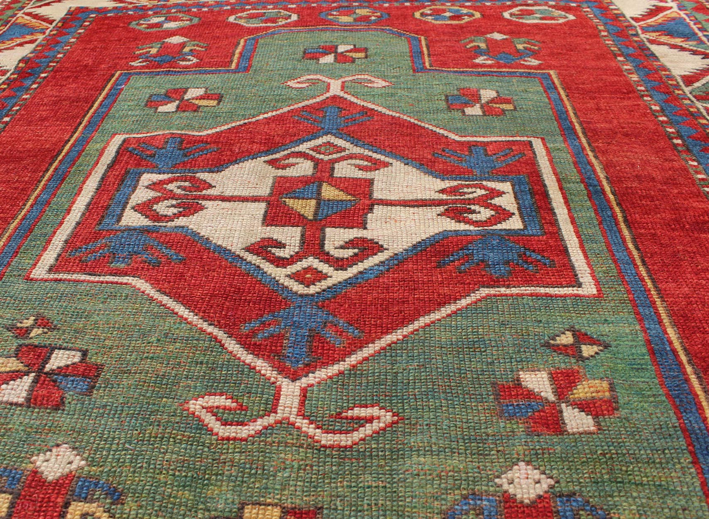 Green Antique Caucasian Fachralo Kazak with Tribal Design in Green, Red and Ivory Antique Caucasian Kazak Rug with Tribal Design in Red, Blue, Green, and Ivory, rug 16 - 0605, country of origin / type: Iran / Caucasian Kazak, circa 1870 Measures: ... - Keivan Woven Arts16 - 0605 - 8662Rug
