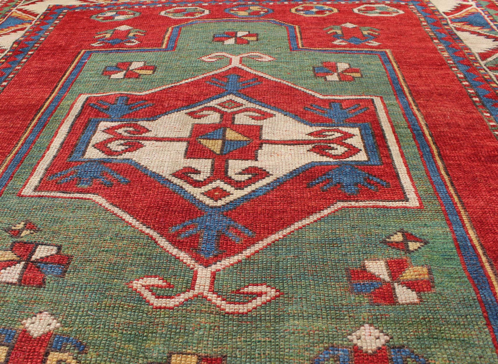 Green Antique Caucasian Fachralo Kazak with Tribal Design in Green, Red and Ivory Antique Caucasian Kazak Rug with Tribal Design in Red, Blue, Green, and Ivory, rug 16 - 0605, country of origin / type: Iran / Caucasian Kazak, circa 1870 Measures: ... - Keivan Woven Arts16 - 0605 - 8662Rug