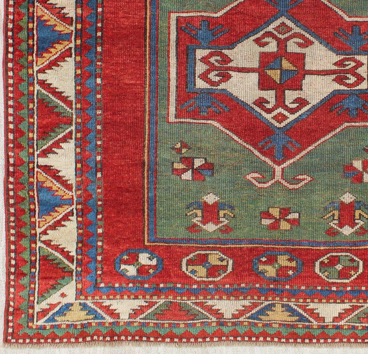 Green Antique Caucasian Fachralo Kazak with Tribal Design in Green, Red and Ivory Antique Caucasian Kazak Rug with Tribal Design in Red, Blue, Green, and Ivory, rug 16 - 0605, country of origin / type: Iran / Caucasian Kazak, circa 1870 Measures: ... - Keivan Woven Arts16 - 0605 - 8662Rug
