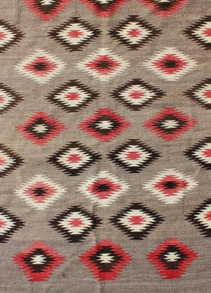 American Navajo Rug with Geometric All - Over Design in Reds and Browns Measures: 3'0'' x 4'10''. This intriguing vintage Navajo rug was woven in the United States during the first half of the 20th century. The exciting and unique composition b... - Keivan Woven Arts16 - 0908 - 7775Rug