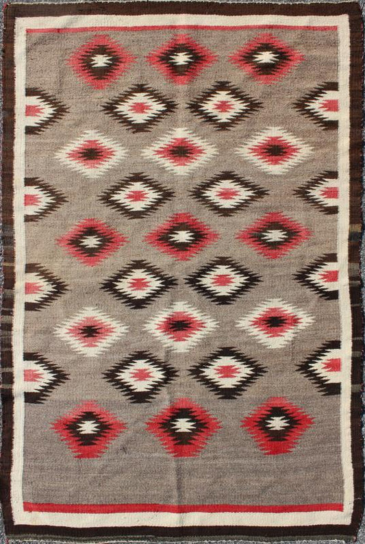 American Navajo Rug with Geometric All - Over Design in Reds and Browns Measures: 3'0'' x 4'10''. This intriguing vintage Navajo rug was woven in the United States during the first half of the 20th century. The exciting and unique composition b... - Keivan Woven Arts16 - 0908 - 7775Rug