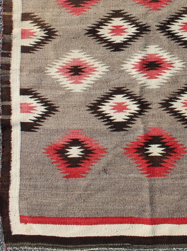 American Navajo Rug with Geometric All - Over Design in Reds and Browns Measures: 3'0'' x 4'10''. This intriguing vintage Navajo rug was woven in the United States during the first half of the 20th century. The exciting and unique composition b... - Keivan Woven Arts16 - 0908 - 7775Rug
