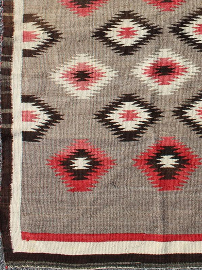 American Navajo Rug with Geometric All - Over Design in Reds and Browns Measures: 3'0'' x 4'10''. This intriguing vintage Navajo rug was woven in the United States during the first half of the 20th century. The exciting and unique composition b... - Keivan Woven Arts16 - 0908 - 7775Rug