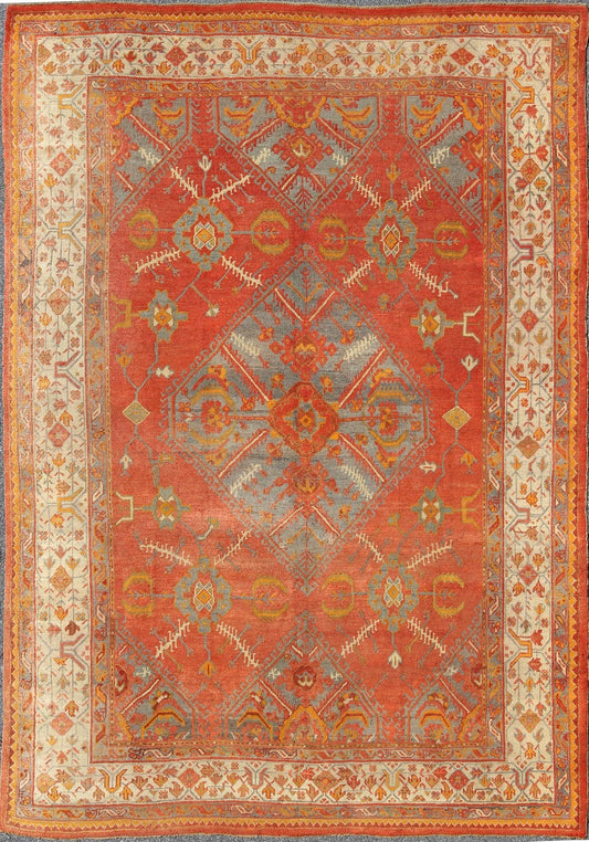 Antique Turkish Oushak rug with tribal Medallion design in terracotta, light gray blue, ivory and gold. Keivan Woven Arts / rug 16 - 0911, country of origin / type: Turkey / Oushak, circa 1900 Measures: 10' x 13'8. This antique Turkish Oushak carpe... - Keivan Woven Arts16 - 0911 - 8678Rug