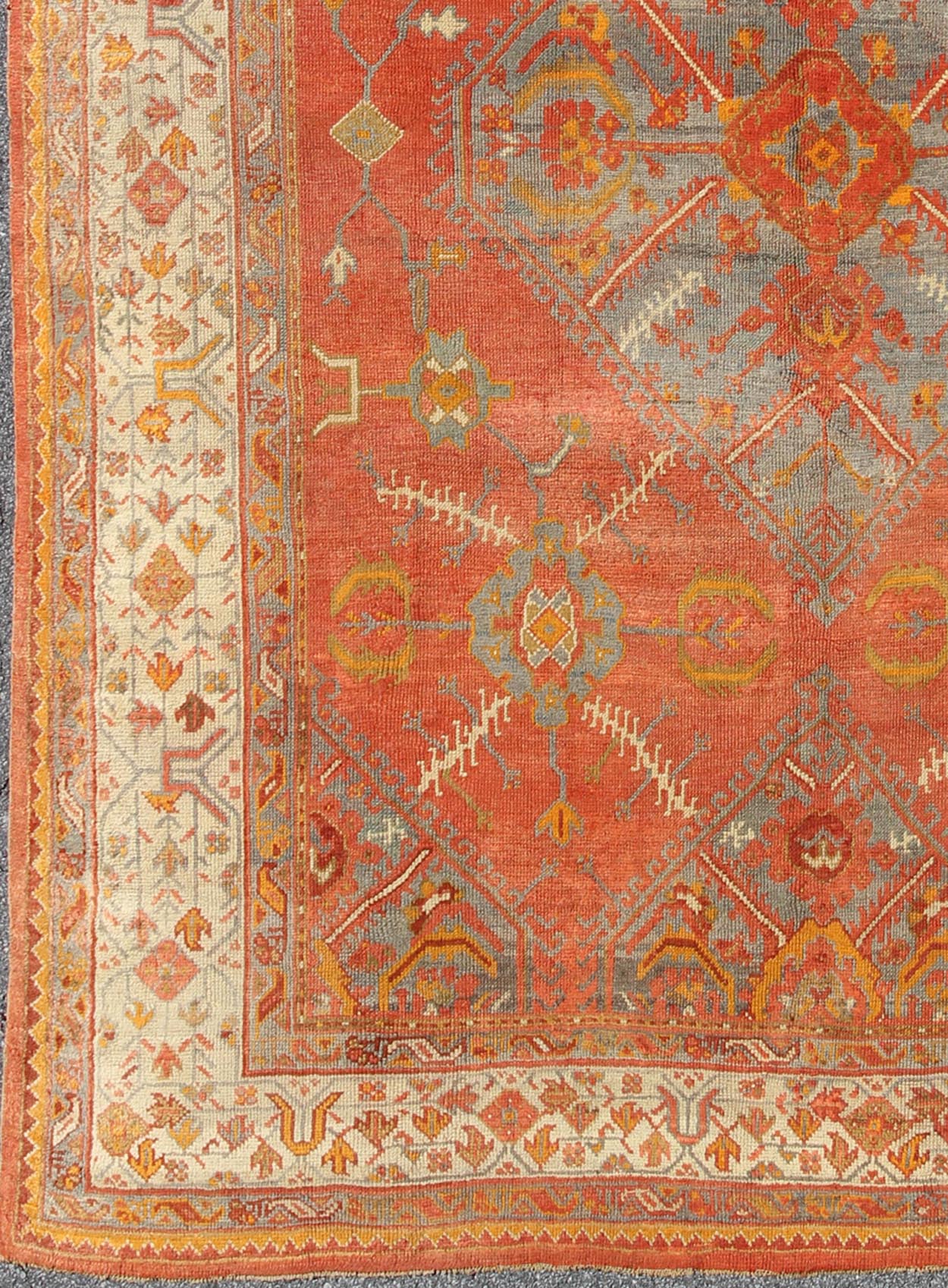 Antique Turkish Oushak rug with tribal Medallion design in terracotta, light gray blue, ivory and gold. Keivan Woven Arts / rug 16 - 0911, country of origin / type: Turkey / Oushak, circa 1900 Measures: 10' x 13'8. This antique Turkish Oushak carpe... - Keivan Woven Arts16 - 0911 - 8678Rug