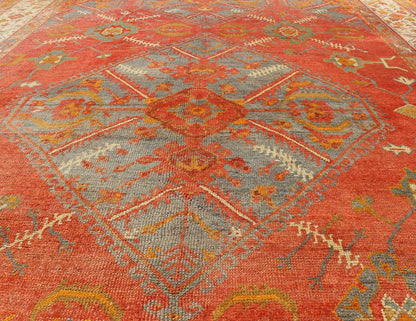 Antique Turkish Oushak rug with tribal Medallion design in terracotta, light gray blue, ivory and gold. Keivan Woven Arts / rug 16 - 0911, country of origin / type: Turkey / Oushak, circa 1900 Measures: 10' x 13'8. This antique Turkish Oushak carpe... - Keivan Woven Arts16 - 0911 - 8678Rug