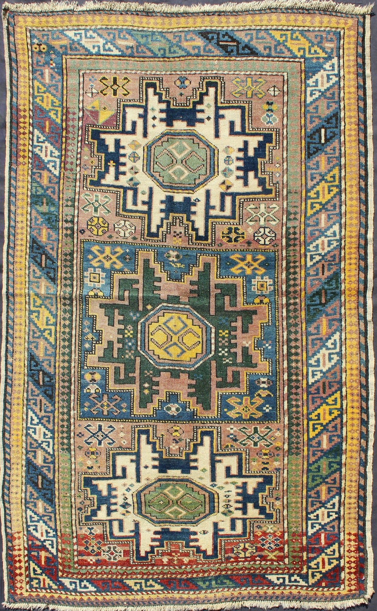 Antique Colorful Kuba Caucasian Rug with Star Medallions in Green, Blue, Yellow. Measures: 3'5'' x 5'7''. Antique Colorful Kuba Caucasian Rug with Star Medallions in Green, Blue, and Yellow, 16 - 0912, This wonderfully colored Kuba rug from th... - Keivan Woven Arts16 - 0912 - 7943Rug