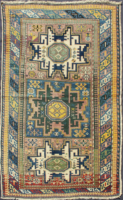Antique Colorful Kuba Caucasian Rug with Star Medallions in Green, Blue, Yellow. Measures: 3'5'' x 5'7''. Antique Colorful Kuba Caucasian Rug with Star Medallions in Green, Blue, and Yellow, 16 - 0912, This wonderfully colored Kuba rug from th... - Keivan Woven Arts16 - 0912 - 7943Rug