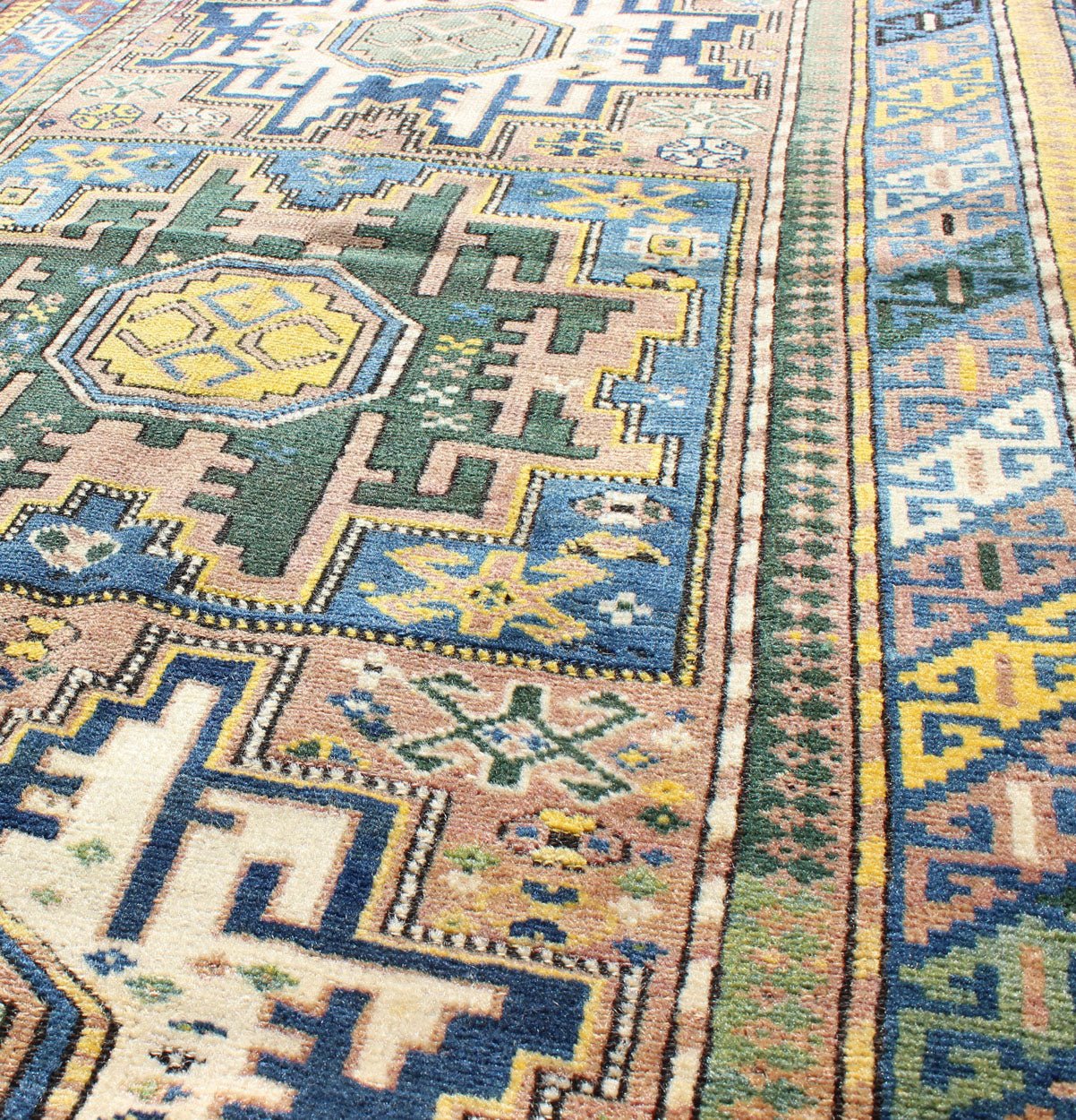 Antique Colorful Kuba Caucasian Rug with Star Medallions in Green, Blue, Yellow. Measures: 3'5'' x 5'7''. Antique Colorful Kuba Caucasian Rug with Star Medallions in Green, Blue, and Yellow, 16 - 0912, This wonderfully colored Kuba rug from th... - Keivan Woven Arts16 - 0912 - 7943Rug