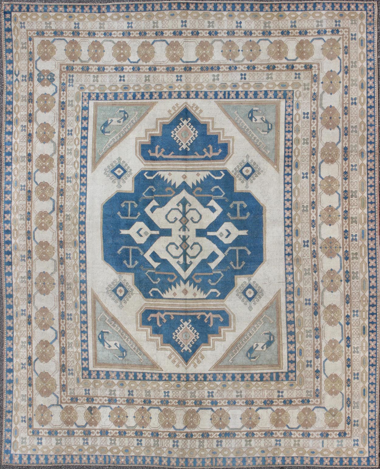 Large vintage Turkish rug with stylized geometric design in blue, ivory, tan. Keivan Woven Arts / rug 16 - 0914, country of origin / type: Turkey / Oushak, circa 1950 Measures: 13' x 15'8. This vintage Turkish Oushak rug features an intricately bea... - Keivan Woven Arts16 - 0914 - 8684Rug
