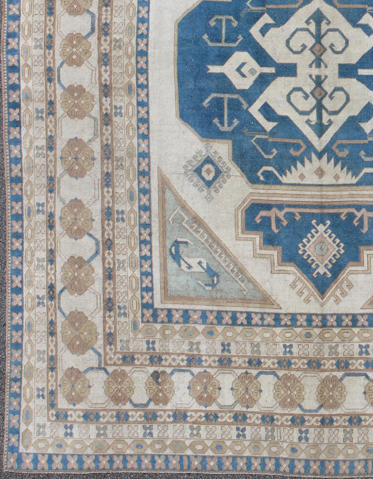Large vintage Turkish rug with stylized geometric design in blue, ivory, tan. Keivan Woven Arts / rug 16 - 0914, country of origin / type: Turkey / Oushak, circa 1950 Measures: 13' x 15'8. This vintage Turkish Oushak rug features an intricately bea... - Keivan Woven Arts16 - 0914 - 8684Rug