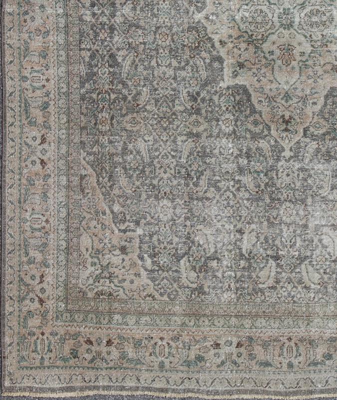 Antique Persian Mahal Rug with Floral Design in Light Gray, Green, Blush/Pink and Light Brown Colors Measures: 10'5 x 13'4 This antique Persian Mahal rug with an understated medallion design has been distressed and features a unique color... - Keivan Woven Arts16 - 0918 - 8295Rug