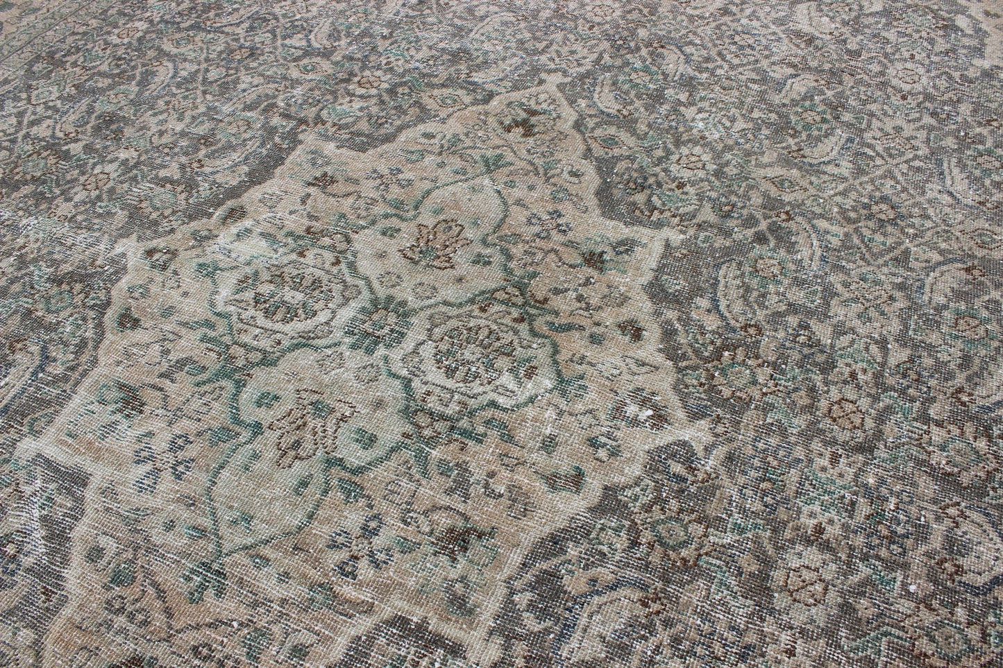 Antique Persian Mahal Rug with Floral Design in Light Gray, Green, Blush/Pink and Light Brown Colors Measures: 10'5 x 13'4 This antique Persian Mahal rug with an understated medallion design has been distressed and features a unique color... - Keivan Woven Arts16 - 0918 - 8295Rug
