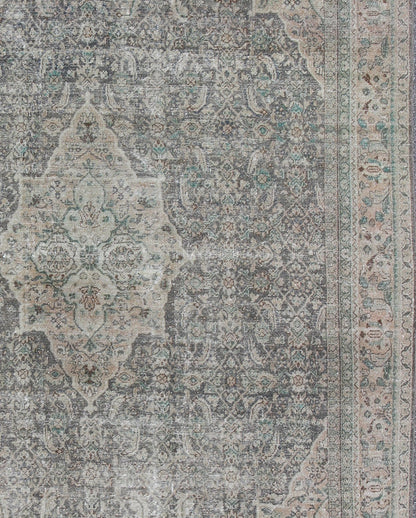 Antique Persian Mahal Rug with Floral Design in Light Gray, Green, Blush/Pink and Light Brown Colors Measures: 10'5 x 13'4 This antique Persian Mahal rug with an understated medallion design has been distressed and features a unique color... - Keivan Woven Arts16 - 0918 - 8295Rug