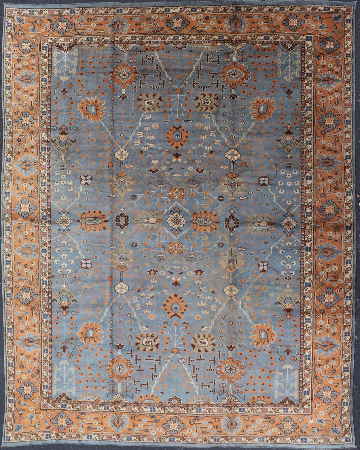 Keivan Woven Arts Antique Turkish All Over Oushak Rug in Blue Background & light Cognac Colored Border . Keivan Woven Arts / rug 16 - 1006, country of origin / type: Turkey / Oushak, circa Early - 20th Century. Antique Turkish All Over Oushak Rug in Blue B... - Keivan Woven Arts16 - 1006 - 8141Rug