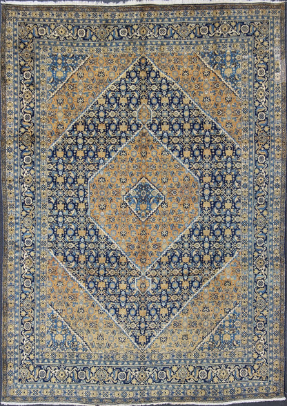 Antique Persian Tabriz Rug with Medallion And A Variety of Blue's and Gold's. Keivan Woven Arts / Rug / 16 - 1205, country of origin / type: Iran / Tabriz, circa 1920. Classic geometric Tabriz. Measures: 9'3 x 12'5. This antique Persian Tabriz rug ... - Keivan Woven Arts16 - 1205 - 8151Rug