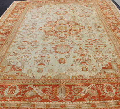 Antique Turkish Floral Oushak Rug in Cream, Rust Red, Orange and Green. Keivan Woven Arts/ Rug 17 - 0103, Origin/Turkey. This finely woven antique large Oushak rug displays an intricate floral design. Set on light Ivory background and rusty red borde... - Keivan Woven Arts17 - 0103 - 8215Rug