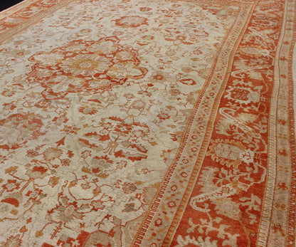 Antique Turkish Floral Oushak Rug in Cream, Rust Red, Orange and Green. Keivan Woven Arts/ Rug 17 - 0103, Origin/Turkey. This finely woven antique large Oushak rug displays an intricate floral design. Set on light Ivory background and rusty red borde... - Keivan Woven Arts17 - 0103 - 8215Rug