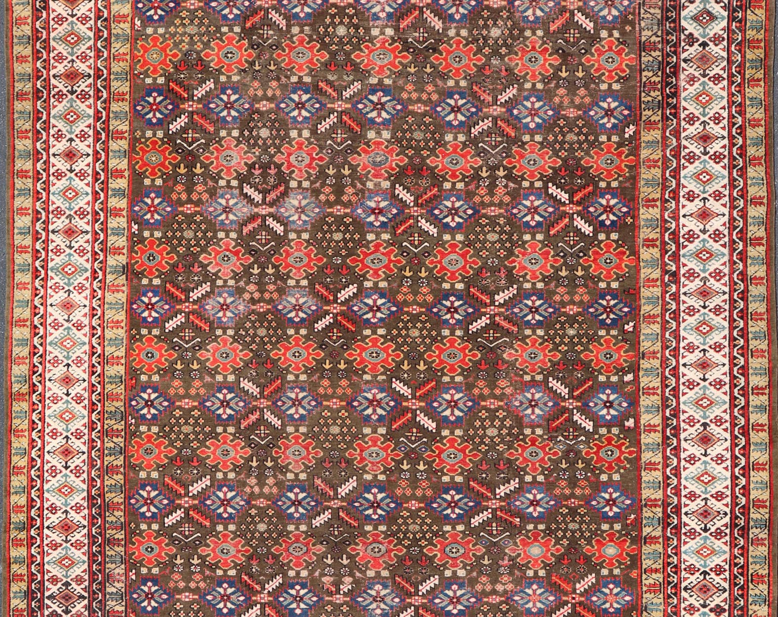 Antique Kurdish rug with brown, red, and blue geometric floral design. Keivan Woven Arts / rug 17 - 0201, country of origin / type: Iran / Kurdish, Early 19th Century, possible late 18th century. Measures: 12'3 x 17'6. This 19th century antique K... - Keivan Woven Arts17 - 0201 - 8205Rug