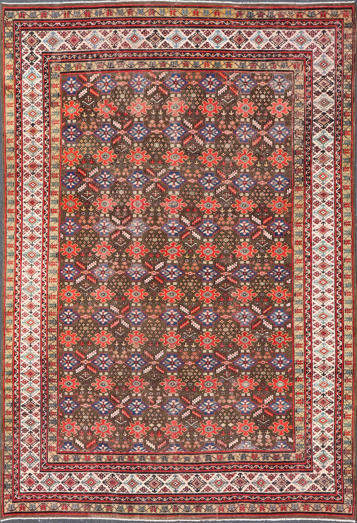 Antique Kurdish rug with brown, red, and blue geometric floral design. Keivan Woven Arts / rug 17 - 0201, country of origin / type: Iran / Kurdish, Early 19th Century, possible late 18th century. Measures: 12'3 x 17'6. This 19th century antique K... - Keivan Woven Arts17 - 0201 - 8205Rug