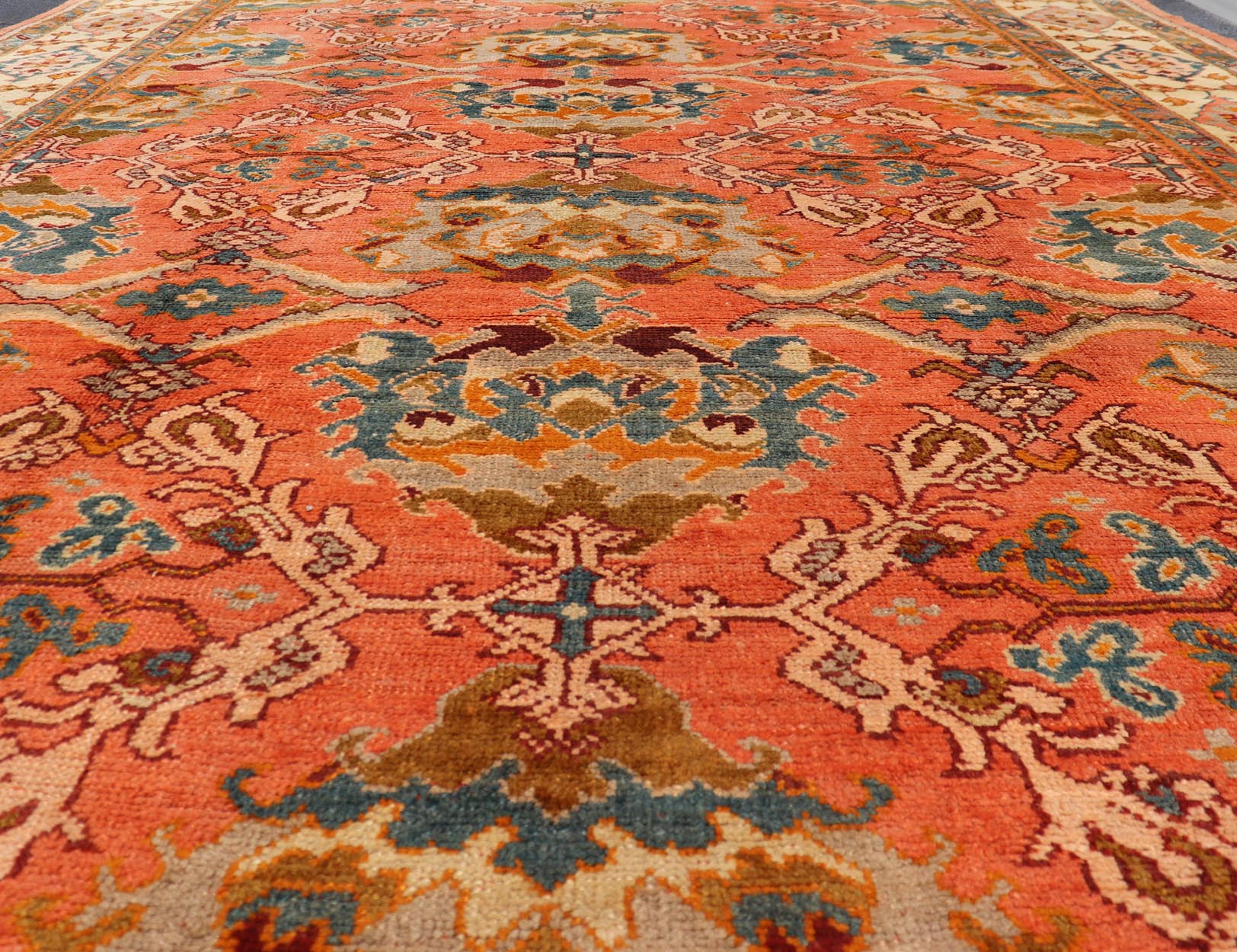Antique Turkish Oushak rug with Large Scale sub floral design in light tangerine/terracotta background. Keivan Woven Arts / rug 17 - 0605, country of origin / type: Turkey / Oushak, circa 1910. Measures: 10'6 x 14'6. This antique Turkish Oushak ca... - Keivan Woven Arts17 - 0605 - 8739Rug