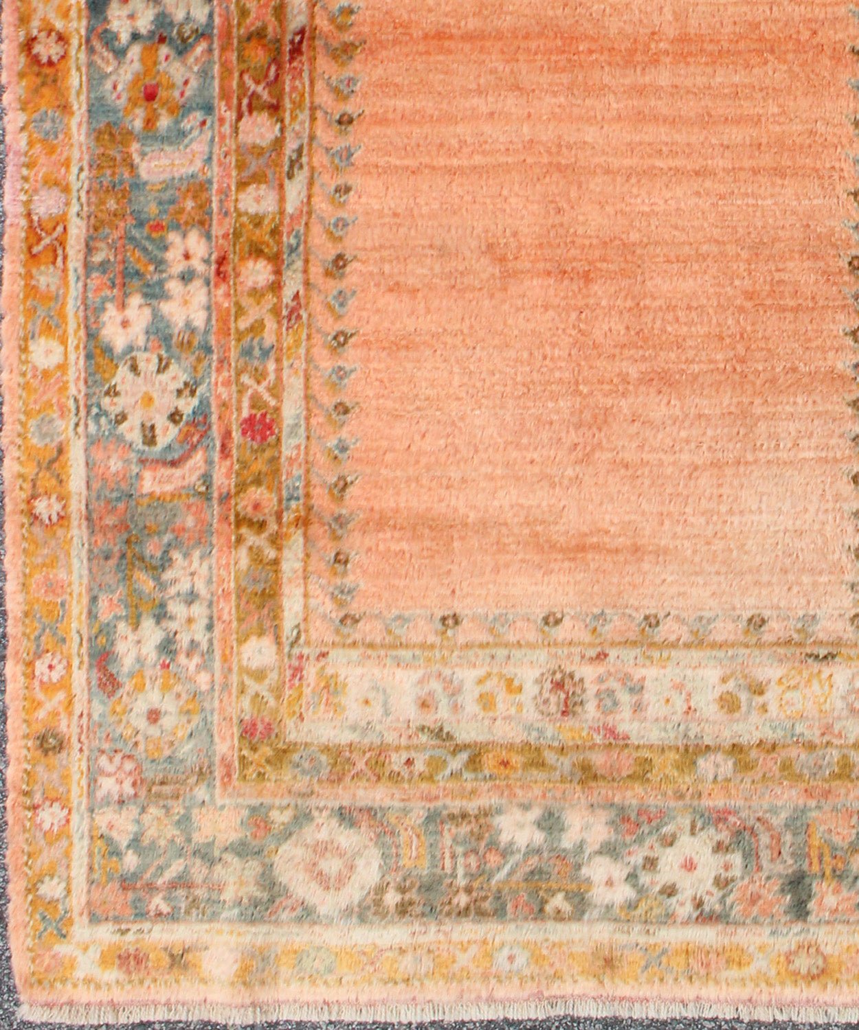 Antique Angora wool Oushak rug with empty salmon field and intricate borders, rug 17 - 0706, country of origin/type: Turkey/Oushak, circa 1900. This antique Turkish rug (circa 1900) features a relatively intricate and detailed border area and an a... - Keivan Woven Arts17 - 0706 - 8753Rug
