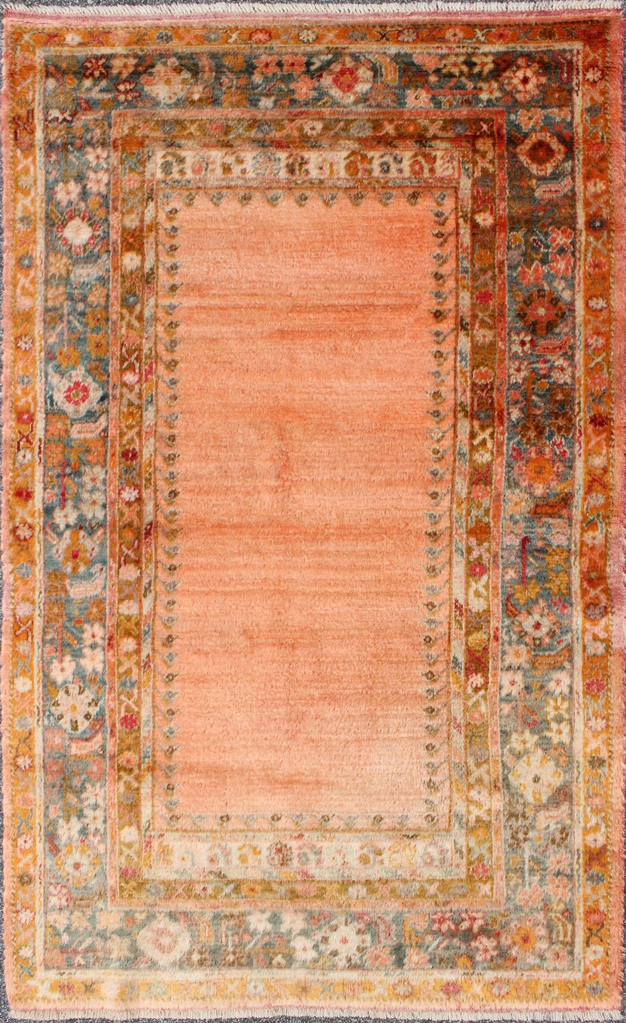 Antique Angora wool Oushak rug with empty salmon field and intricate borders, rug 17 - 0706, country of origin/type: Turkey/Oushak, circa 1900. This antique Turkish rug (circa 1900) features a relatively intricate and detailed border area and an a... - Keivan Woven Arts17 - 0706 - 8753Rug