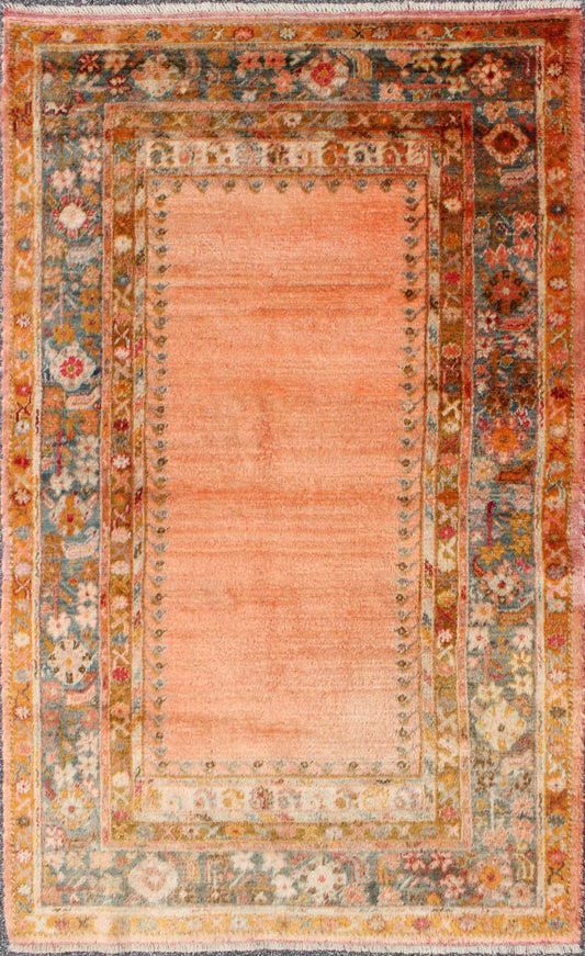 Antique Angora wool Oushak rug with empty salmon field and intricate borders, rug 17 - 0706, country of origin/type: Turkey/Oushak, circa 1900. This antique Turkish rug (circa 1900) features a relatively intricate and detailed border area and an a... - Keivan Woven Arts17 - 0706 - 8753Rug