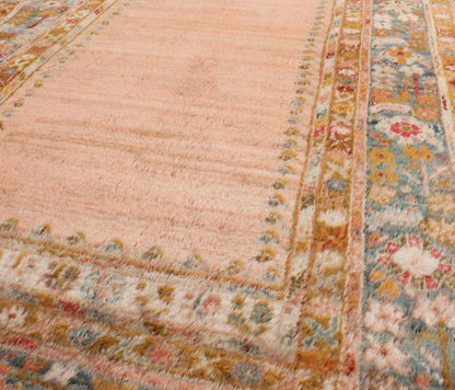 Antique Angora wool Oushak rug with empty salmon field and intricate borders, rug 17 - 0706, country of origin/type: Turkey/Oushak, circa 1900. This antique Turkish rug (circa 1900) features a relatively intricate and detailed border area and an a... - Keivan Woven Arts17 - 0706 - 8753Rug