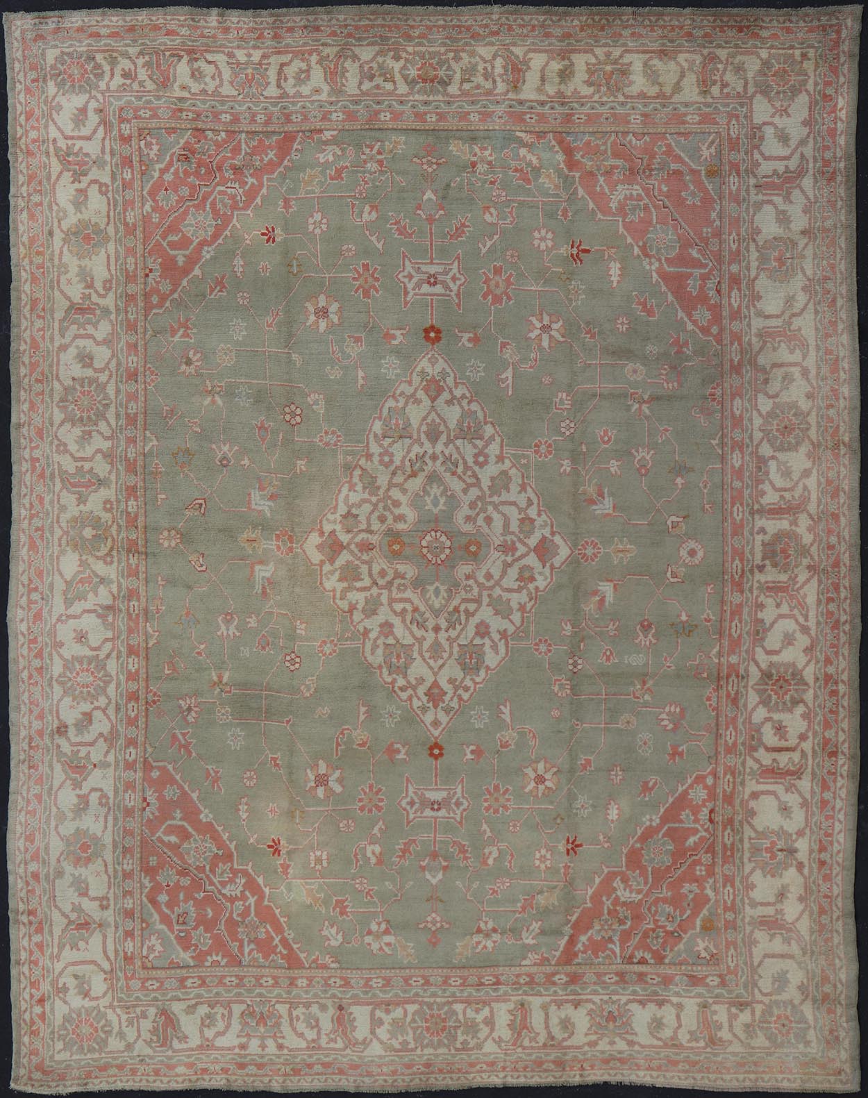 Antique Hand Knotted Turkish Oushak With Large Medallion in Soft Green Antique Turkish Oushak rug with floral design in light green and soft pink. Keivan Woven Arts / rug 17 - 1101, country of origin / type: Turkey / Oushak, circa 1930 Measures: 1... - Keivan Woven Arts17 - 1101 - 9242Rug