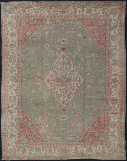 Antique Hand Knotted Turkish Oushak With Large Medallion in Soft Green Antique Turkish Oushak rug with floral design in light green and soft pink. Keivan Woven Arts / rug 17 - 1101, country of origin / type: Turkey / Oushak, circa 1930 Measures: 1... - Keivan Woven Arts17 - 1101 - 9242Rug
