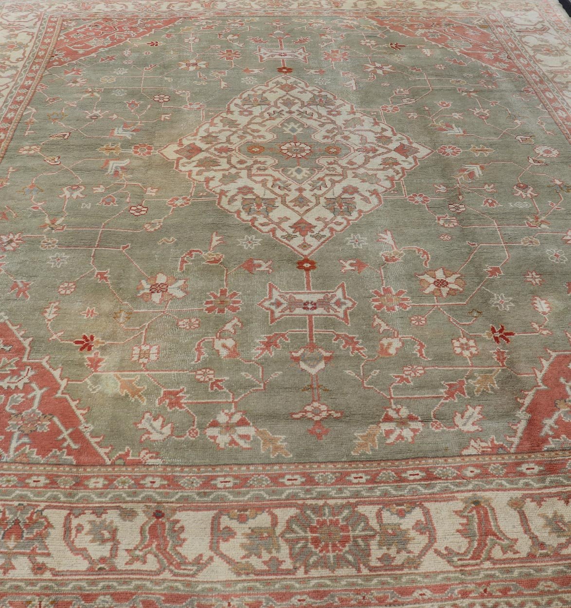 Antique Hand Knotted Turkish Oushak With Large Medallion in Soft Green Antique Turkish Oushak rug with floral design in light green and soft pink. Keivan Woven Arts / rug 17 - 1101, country of origin / type: Turkey / Oushak, circa 1930 Measures: 1... - Keivan Woven Arts17 - 1101 - 9242Rug