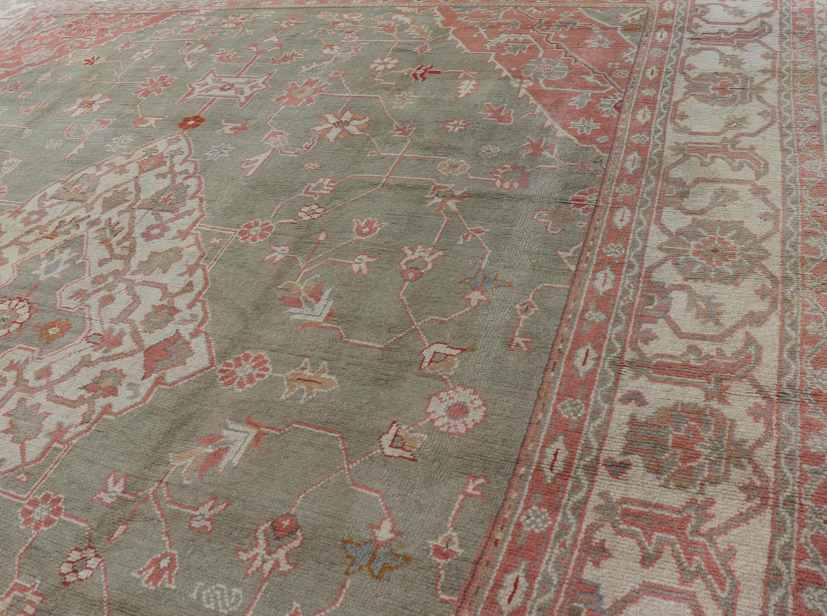 Antique Hand Knotted Turkish Oushak With Large Medallion in Soft Green Antique Turkish Oushak rug with floral design in light green and soft pink. Keivan Woven Arts / rug 17 - 1101, country of origin / type: Turkey / Oushak, circa 1930 Measures: 1... - Keivan Woven Arts17 - 1101 - 9242Rug