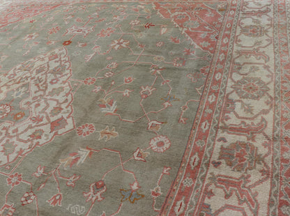 Antique Hand Knotted Turkish Oushak With Large Medallion in Soft Green Antique Turkish Oushak rug with floral design in light green and soft pink. Keivan Woven Arts / rug 17 - 1101, country of origin / type: Turkey / Oushak, circa 1930 Measures: 1... - Keivan Woven Arts17 - 1101 - 9242Rug