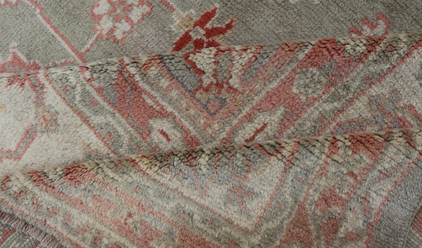 Antique Hand Knotted Turkish Oushak With Large Medallion in Soft Green Antique Turkish Oushak rug with floral design in light green and soft pink. Keivan Woven Arts / rug 17 - 1101, country of origin / type: Turkey / Oushak, circa 1930 Measures: 1... - Keivan Woven Arts17 - 1101 - 9242Rug