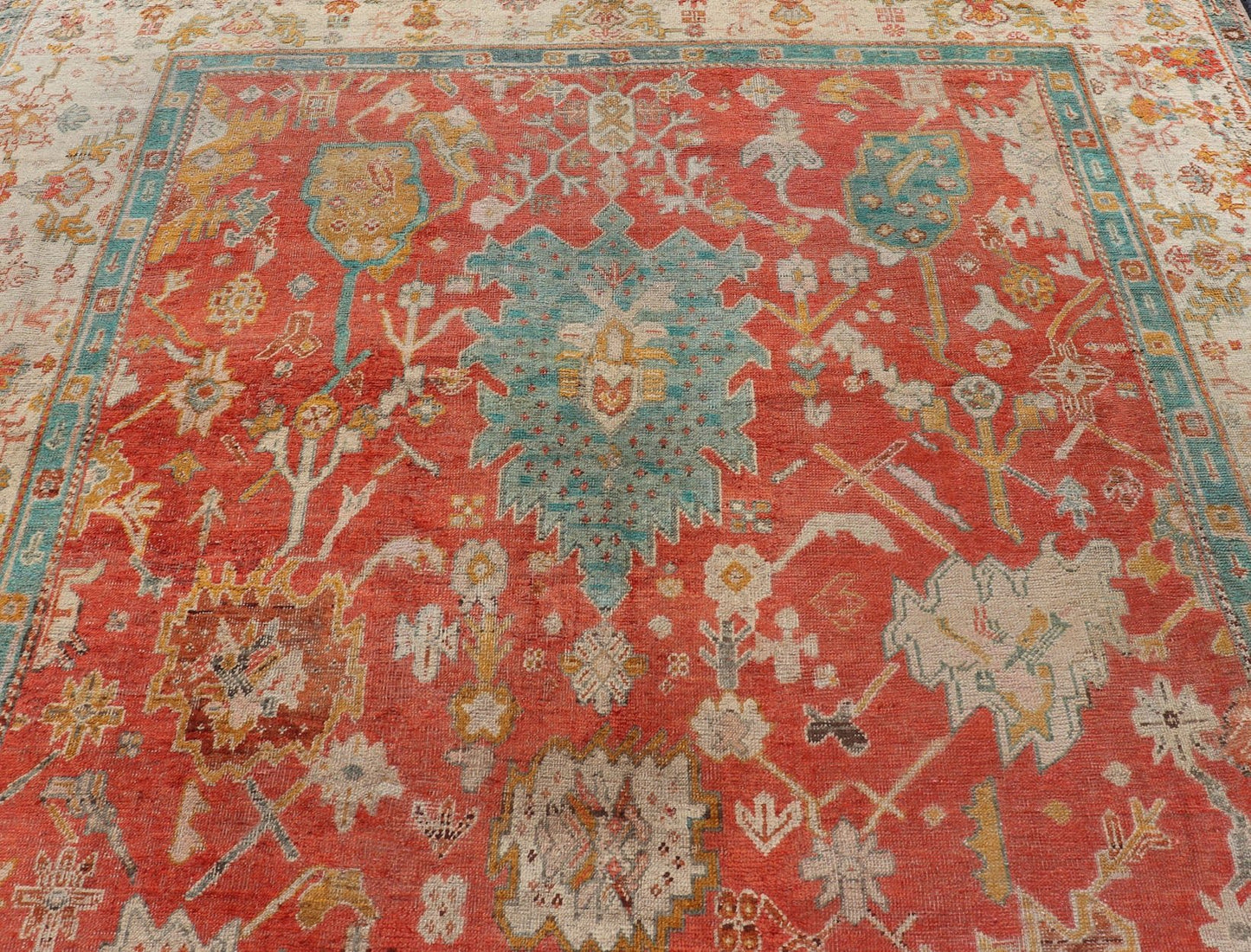 Antique Turkish Oushak In Tribal Motifs in Soft Coral, Blue, Marigold, and Cream Antique Turkish Oushak rug with tribal Medallion design in terracotta, blue, cream, and marigold. Keivan Woven Arts / rug / 17 - 1108 - K - 105, country of origin / type:... - Keivan Woven Arts17 - 1108 - K - 105 - 9272Rug