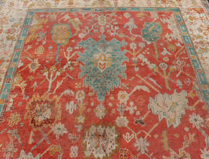 Antique Turkish Oushak In Tribal Motifs in Soft Coral, Blue, Marigold, and Cream Antique Turkish Oushak rug with tribal Medallion design in terracotta, blue, cream, and marigold. Keivan Woven Arts / rug / 17 - 1108 - K - 105, country of origin / type:... - Keivan Woven Arts17 - 1108 - K - 105 - 9272Rug