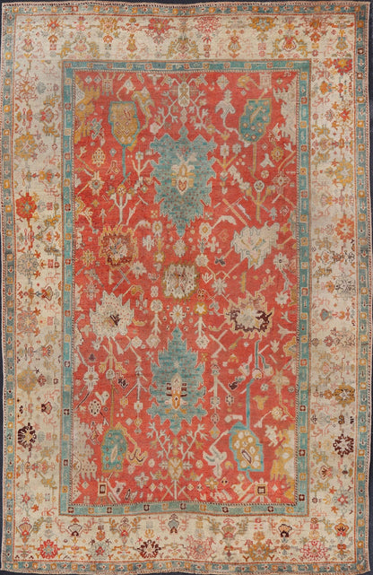 Antique Turkish Oushak In Tribal Motifs in Soft Coral, Blue, Marigold, and Cream Antique Turkish Oushak rug with tribal Medallion design in terracotta, blue, cream, and marigold. Keivan Woven Arts / rug / 17 - 1108 - K - 105, country of origin / type:... - Keivan Woven Arts17 - 1108 - K - 105 - 9272Rug