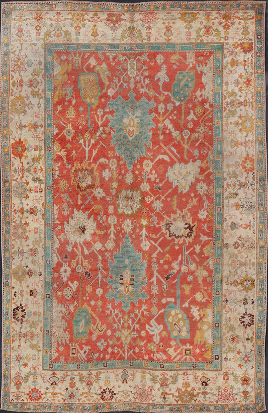 Antique Turkish Oushak In Tribal Motifs in Soft Coral, Blue, Marigold, and Cream Antique Turkish Oushak rug with tribal Medallion design in terracotta, blue, cream, and marigold. Keivan Woven Arts / rug / 17 - 1108 - K - 105, country of origin / type:... - Keivan Woven Arts17 - 1108 - K - 105 - 9272Rug