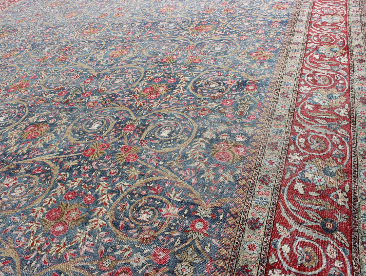 Large Palace size Antique Persian Tabriz Rug in Vine Scroll Design in Blue Background, Red. Blue background, Red border and multi colors such as light green, taupe, light blue/gray antique Persian Tabriz Large rug with flowers and all - over vine scr... - Keivan Woven Arts18 - 0403 - 9705Rug