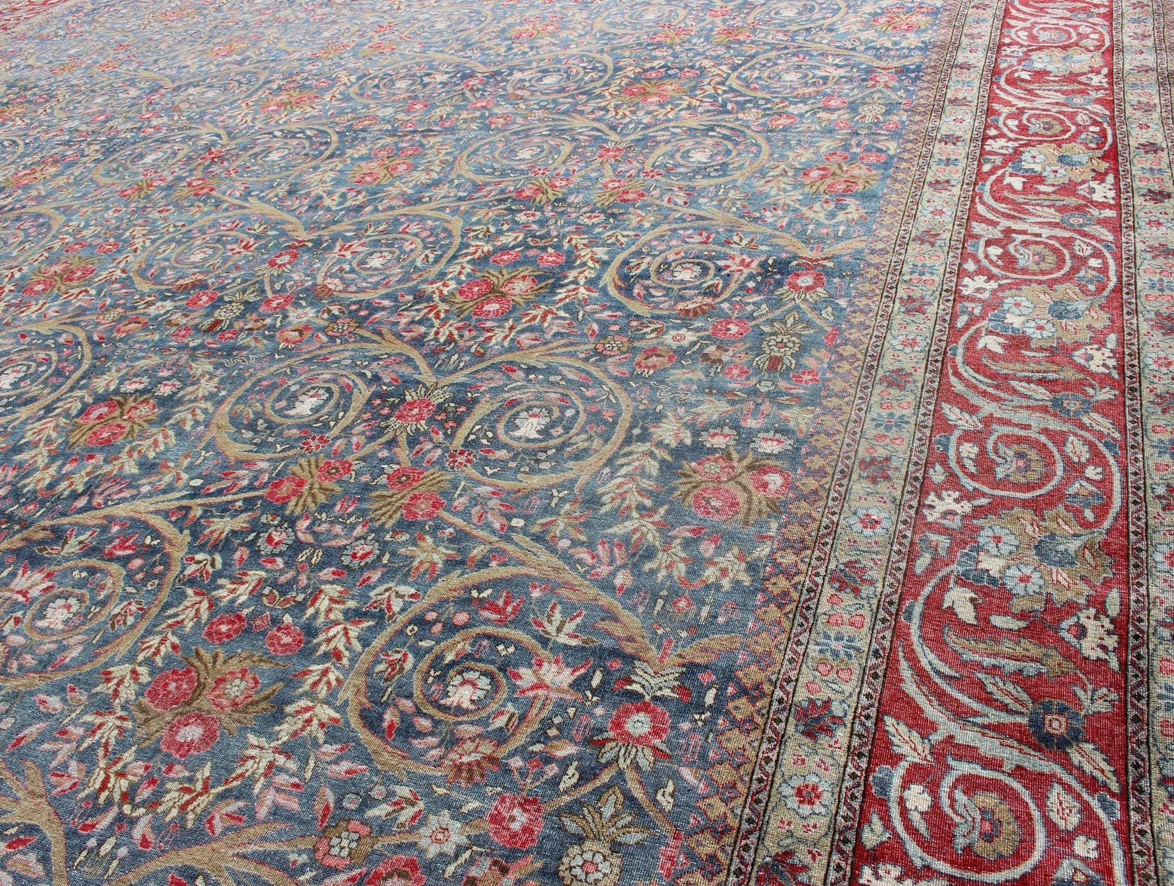 Large Palace size Antique Persian Tabriz Rug in Vine Scroll Design in Blue Background, Red. Blue background, Red border and multi colors such as light green, taupe, light blue/gray antique Persian Tabriz Large rug with flowers and all - over vine scr... - Keivan Woven Arts18 - 0403 - 9705Rug