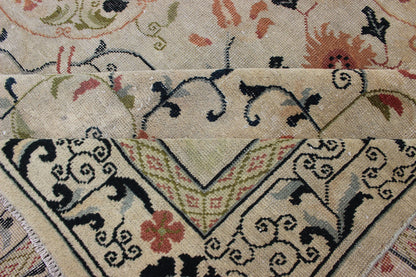 Antique Khotan Rug with Ivory Field in navy blue, coral, ivory, green, and gray. Antique Khotan rug with creamy ivory field and floral design, Keivan Woven Arts / rug 18 - 0502, country of origin / type: Turkestan / Khotan, 1930 This attrac... - Keivan Woven Arts18 - 0502 - 10072Rug