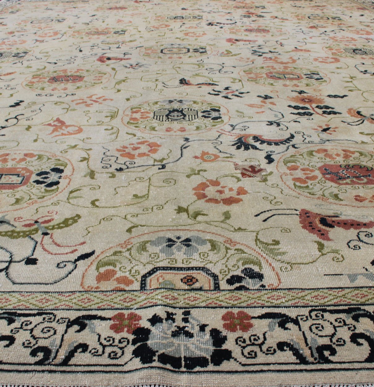 Antique Khotan Rug with Ivory Field in navy blue, coral, ivory, green, and gray. Antique Khotan rug with creamy ivory field and floral design, Keivan Woven Arts / rug 18 - 0502, country of origin / type: Turkestan / Khotan, 1930 This attrac... - Keivan Woven Arts18 - 0502 - 10072Rug