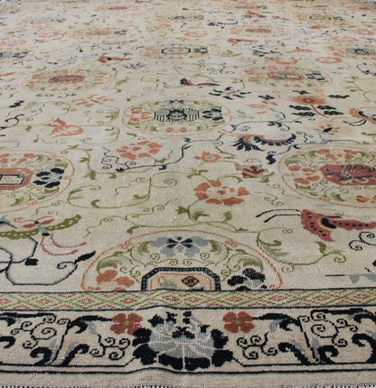 Antique Khotan Rug with Ivory Field in navy blue, coral, ivory, green, and gray. Antique Khotan rug with creamy ivory field and floral design, Keivan Woven Arts / rug 18 - 0502, country of origin / type: Turkestan / Khotan, 1930 This attrac... - Keivan Woven Arts18 - 0502 - 10072Rug