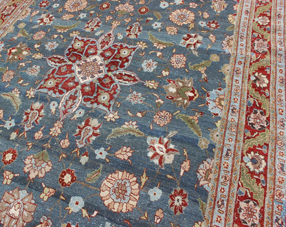Antique Persian Tabriz Rug with Floral Medallion Design in Steel Blue & Red. Steel blue, antique Persian Tabriz rug with flowers and medallion, rug 18 - 0702, country of origin / type: Iran / Tabriz, circa 1920. This sublime and enchanting vin... - Keivan Woven Arts18 - 0702 - 10002Rug