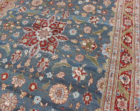 Antique Persian Tabriz Rug with Floral Medallion Design in Steel Blue & Red. Steel blue, antique Persian Tabriz rug with flowers and medallion, rug 18 - 0702, country of origin / type: Iran / Tabriz, circa 1920. This sublime and enchanting vin... - Keivan Woven Arts18 - 0702 - 10002Rug