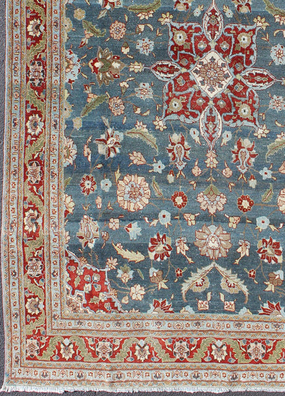 Antique Persian Tabriz Rug with Floral Medallion Design in Steel Blue & Red. Steel blue, antique Persian Tabriz rug with flowers and medallion, rug 18 - 0702, country of origin / type: Iran / Tabriz, circa 1920. This sublime and enchanting vin... - Keivan Woven Arts18 - 0702 - 10002Rug