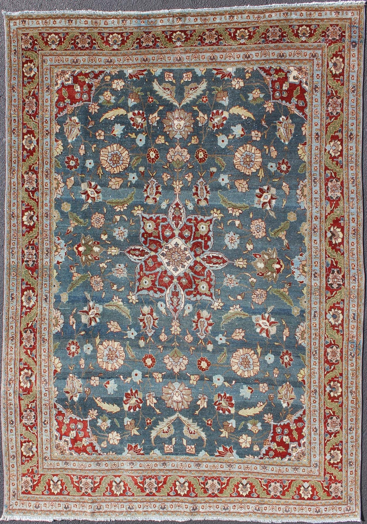 Antique Persian Tabriz Rug with Floral Medallion Design in Steel Blue & Red. Steel blue, antique Persian Tabriz rug with flowers and medallion, rug 18 - 0702, country of origin / type: Iran / Tabriz, circa 1920. This sublime and enchanting vin... - Keivan Woven Arts18 - 0702 - 10002Rug